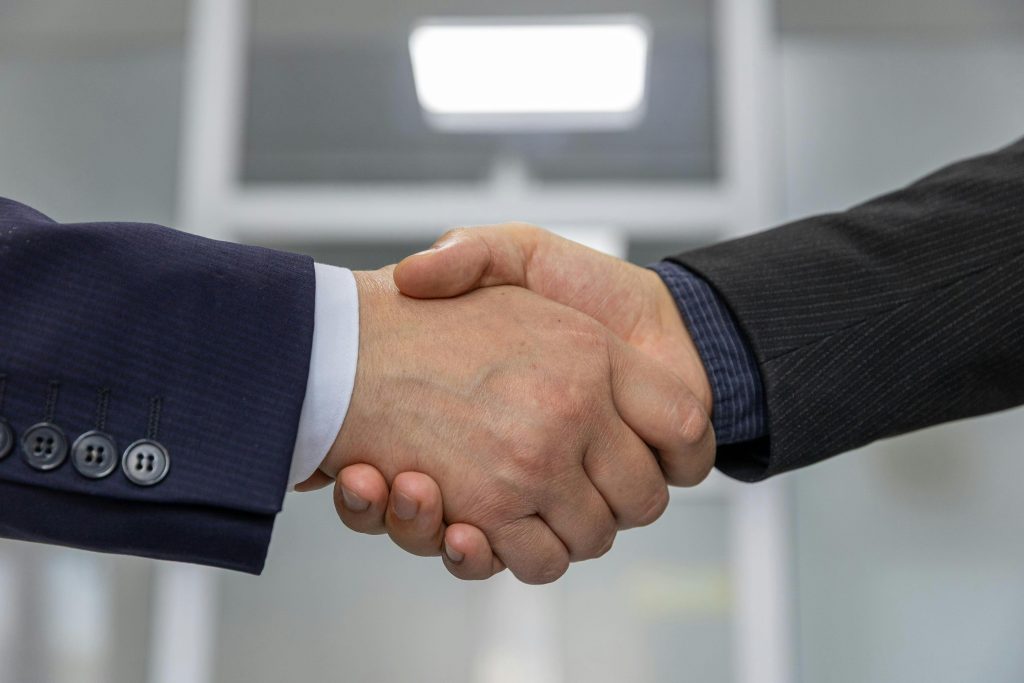 pexels-photo-33175648-33175648 Close-up of a business handshake representing a successful partnership or agreement.